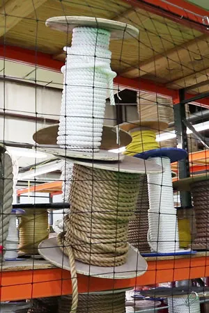 Rack safety netting installed on a rack preventing items from falling off of it.