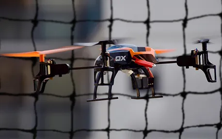 drone inside of netting in a city