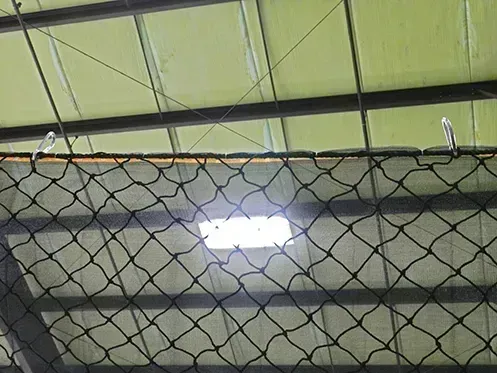 Fall safety netting with debris liner