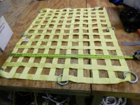 Yellow cargo netting rings